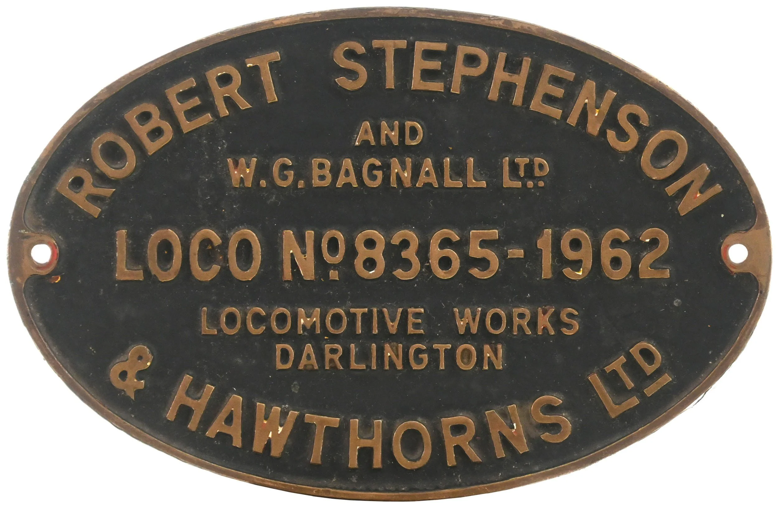 A vintage round plaque with raised lettering that reads 'Robert Stephens and W.G. Bagnall Ltd' and 'Locomotive Works Darlington'.