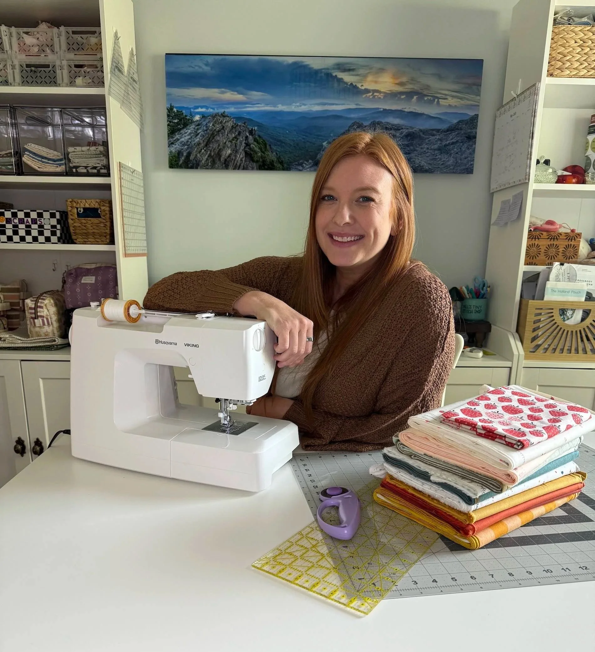 Melanie Covington sitting at her sewing machine.