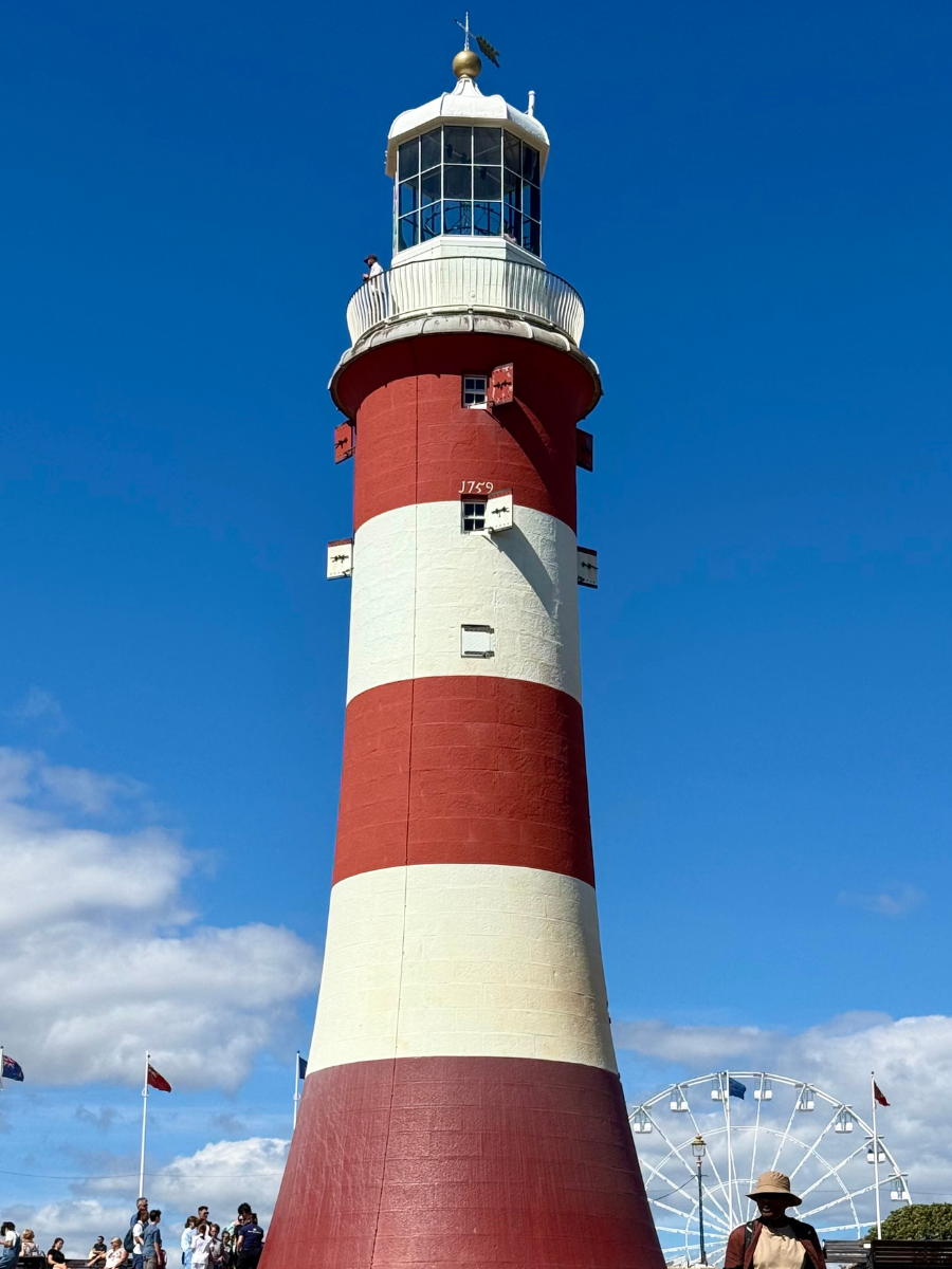 The unmistakable red and white striped Smeaton's Tower standing proudly on Plymouth Hoe