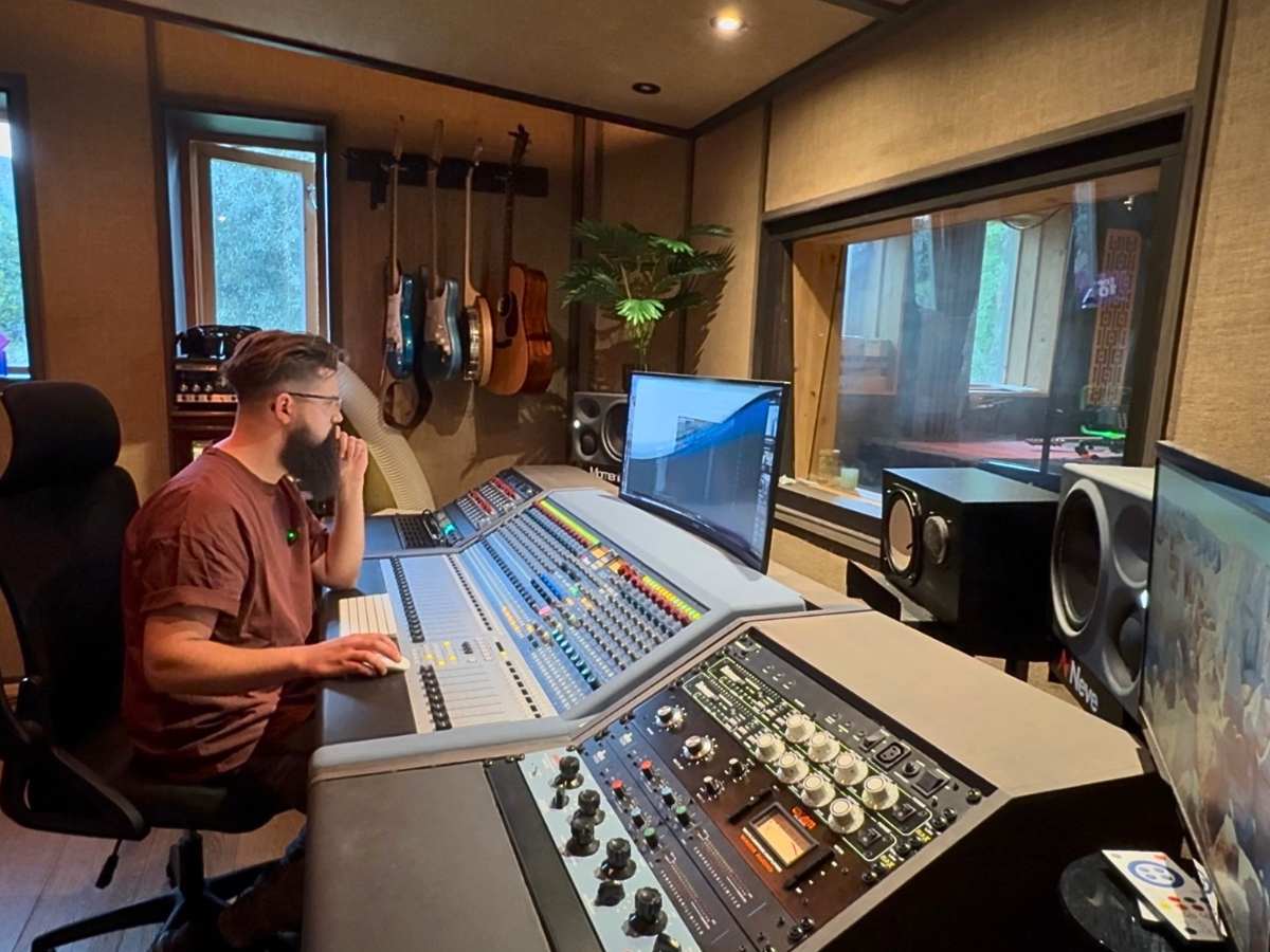 Josiah at the mixing desk in his studio