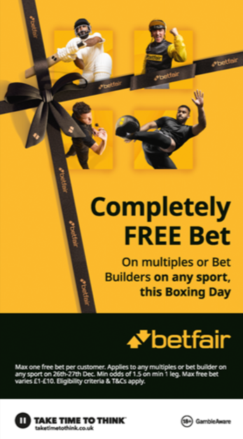 Promotional advertisement for Betfair offering a completely free bet on Boxing Day, with images of four athletes in boxing or sports gear, and a black ribbon tied like a gift box.