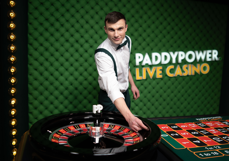 Casino dealer placing a bet on a roulette table at Paddy Power Live Casino.