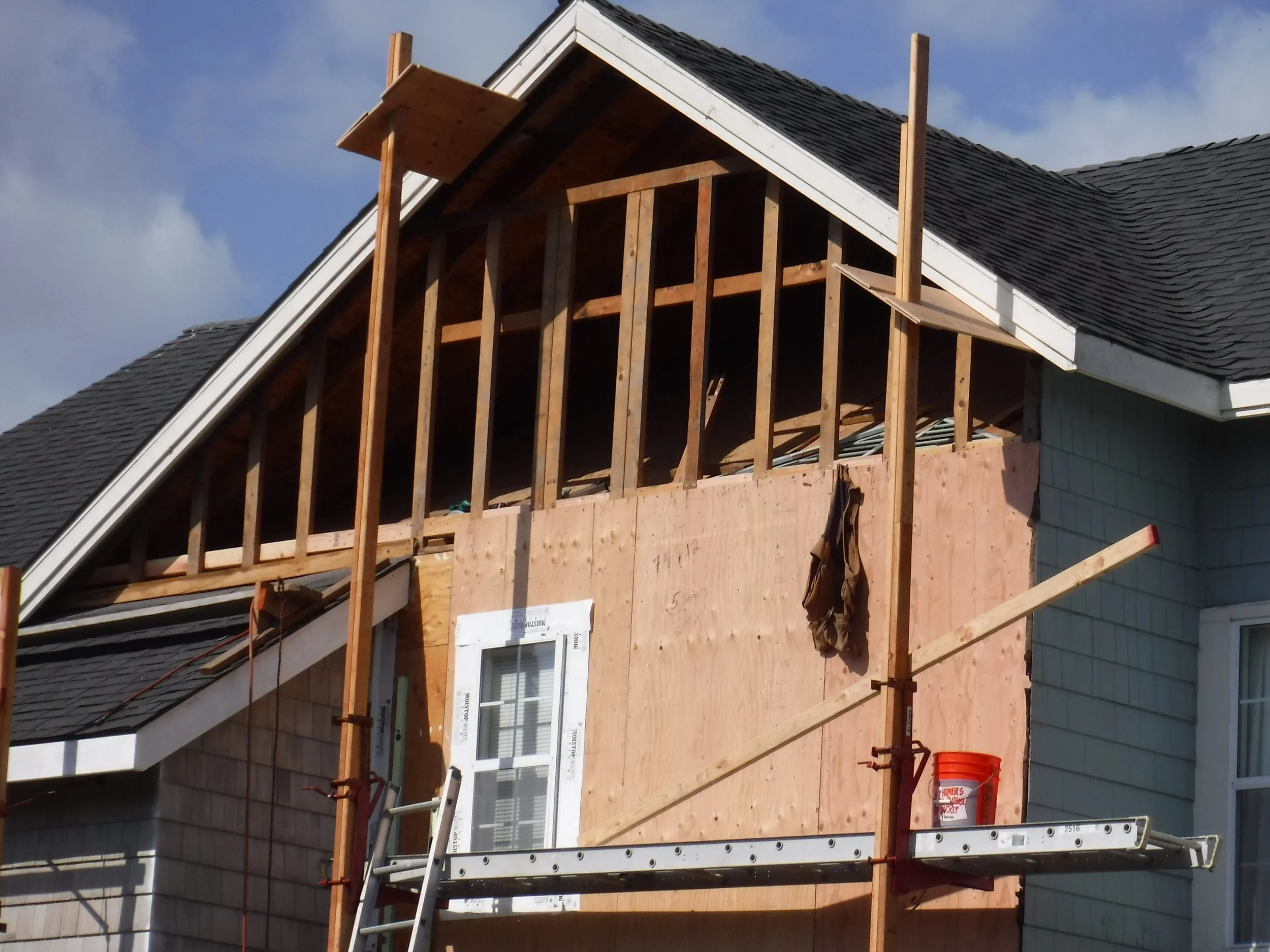 Oranssi technician working on a roof project