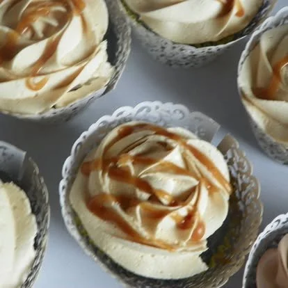 Dessert cups with vanilla ice cream topped with caramel sauce