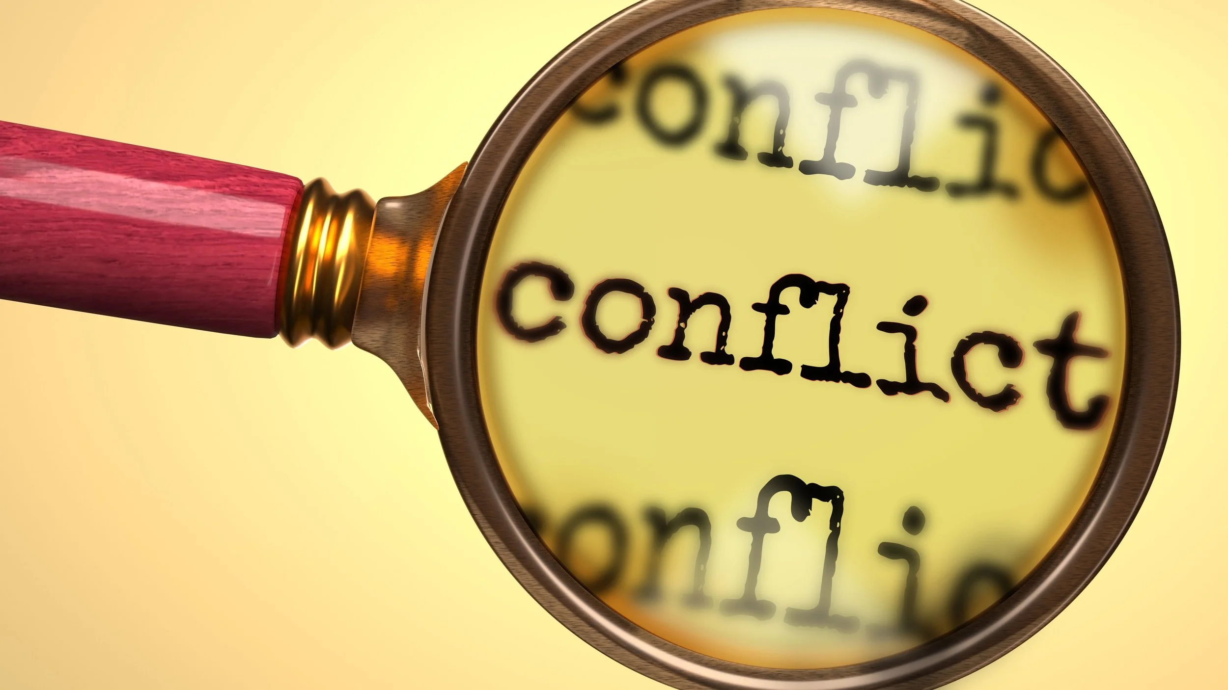 Magnifying glass enlarging the word “conflict”