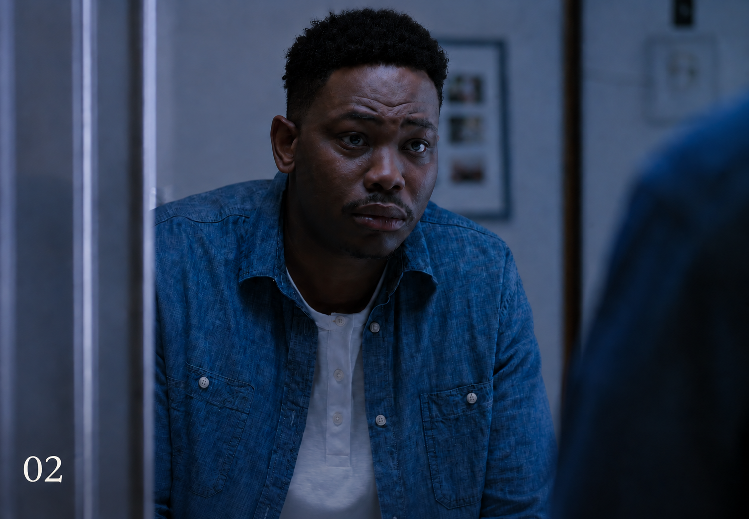 A man in a blue shirt leaning toward a mirror in Biohaven’s epilepsy awareness campaign.