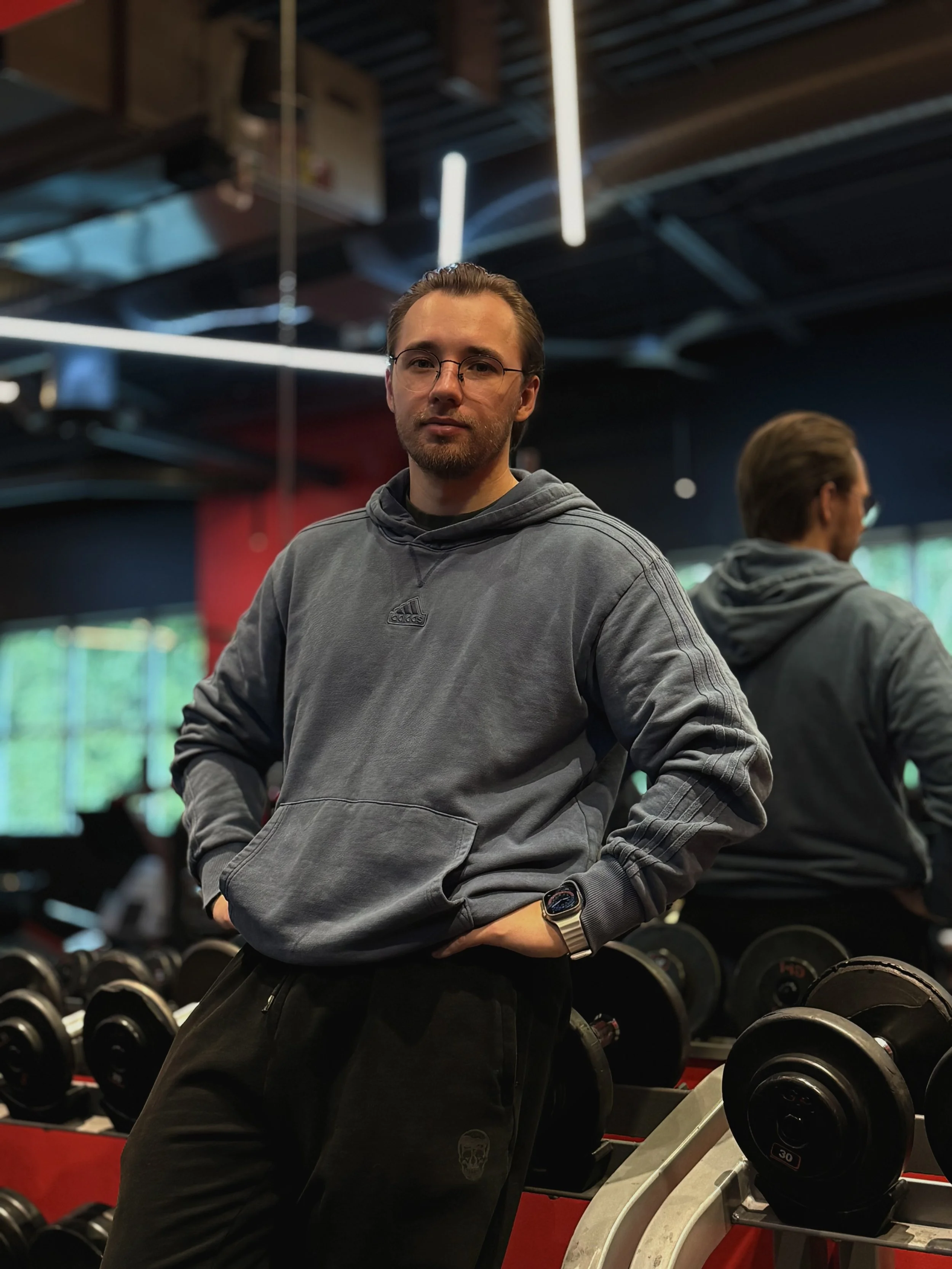 Personal trainer Bohdan Melnyk standing in a gym in Redmond, Washington.