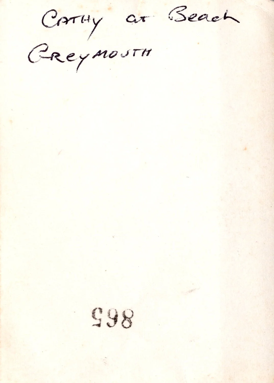 Handwritten note on a white background that says "Cathy at Beach Greymooth" and the number 998 at the bottom.