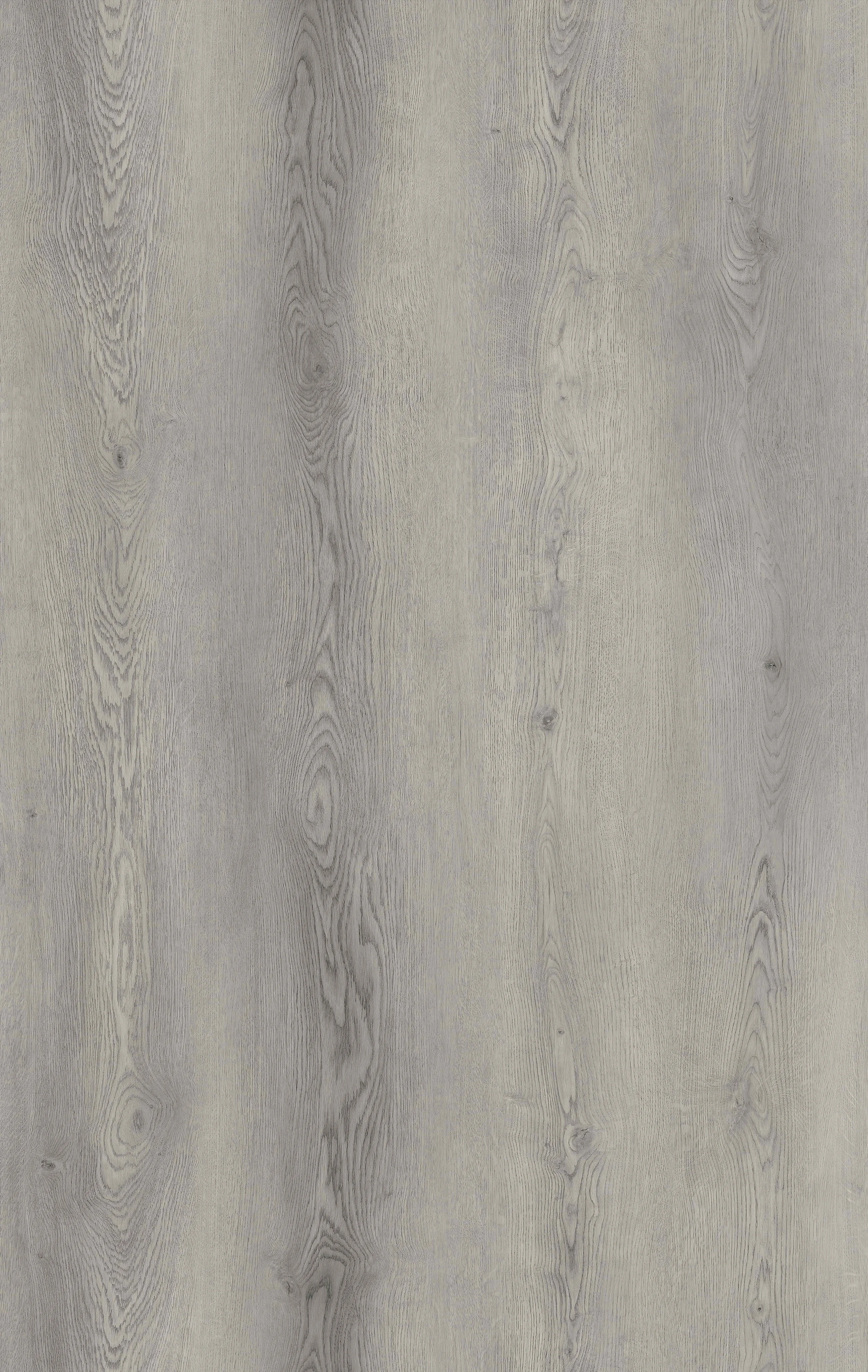 A wooden surface with a light gray finish and visible wood grain patterns.