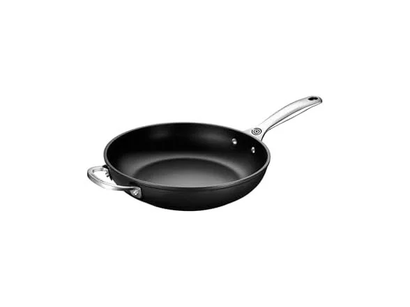 A black non-stick frying pan with a long silver handle and a small side handle on a white background.