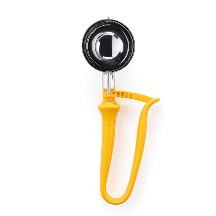 A cookie scoop with a yellow handle