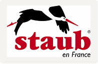 Staub logo with a silhouette of a person cooking over a red background