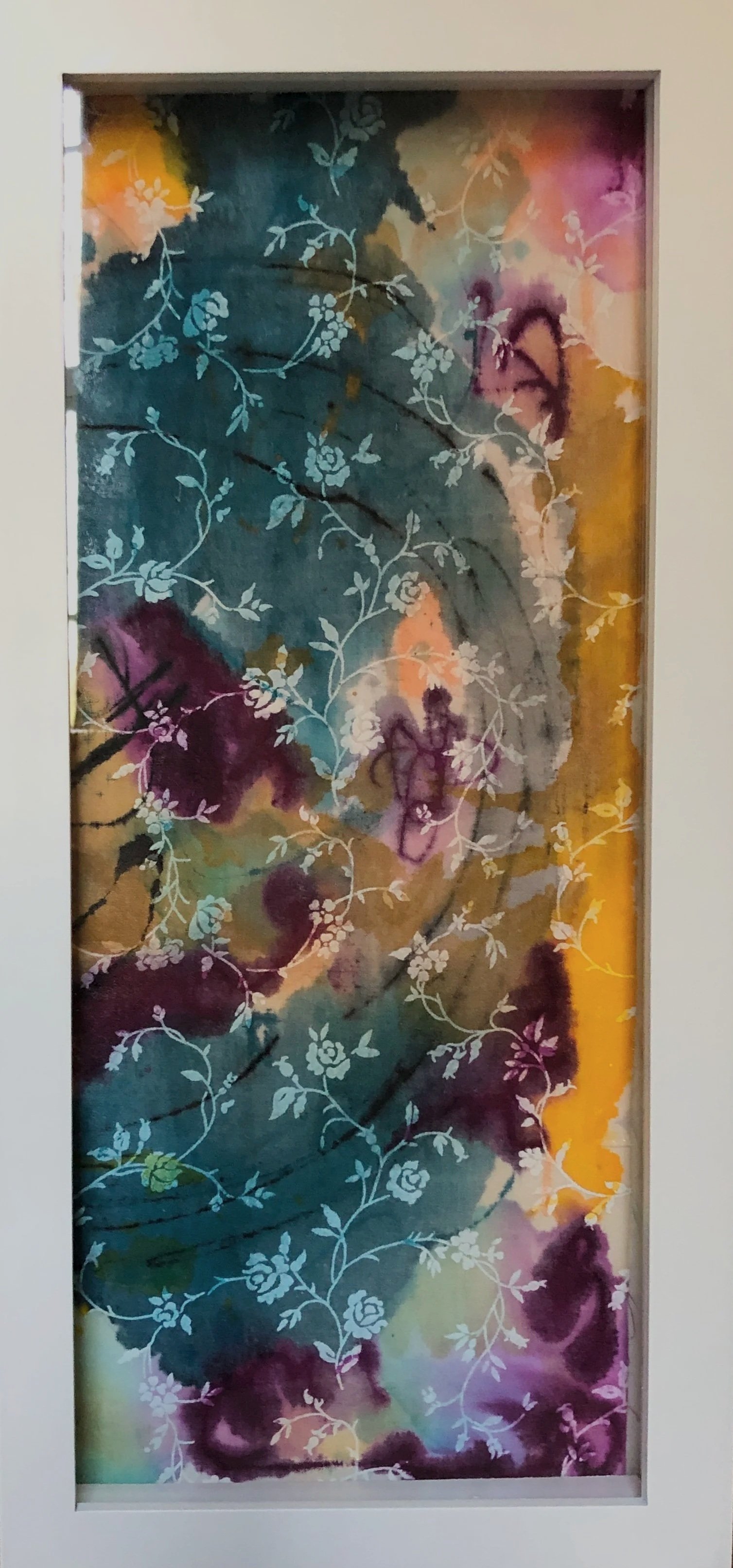 Colorful abstract art with floral vine patterns on a vertical surface.