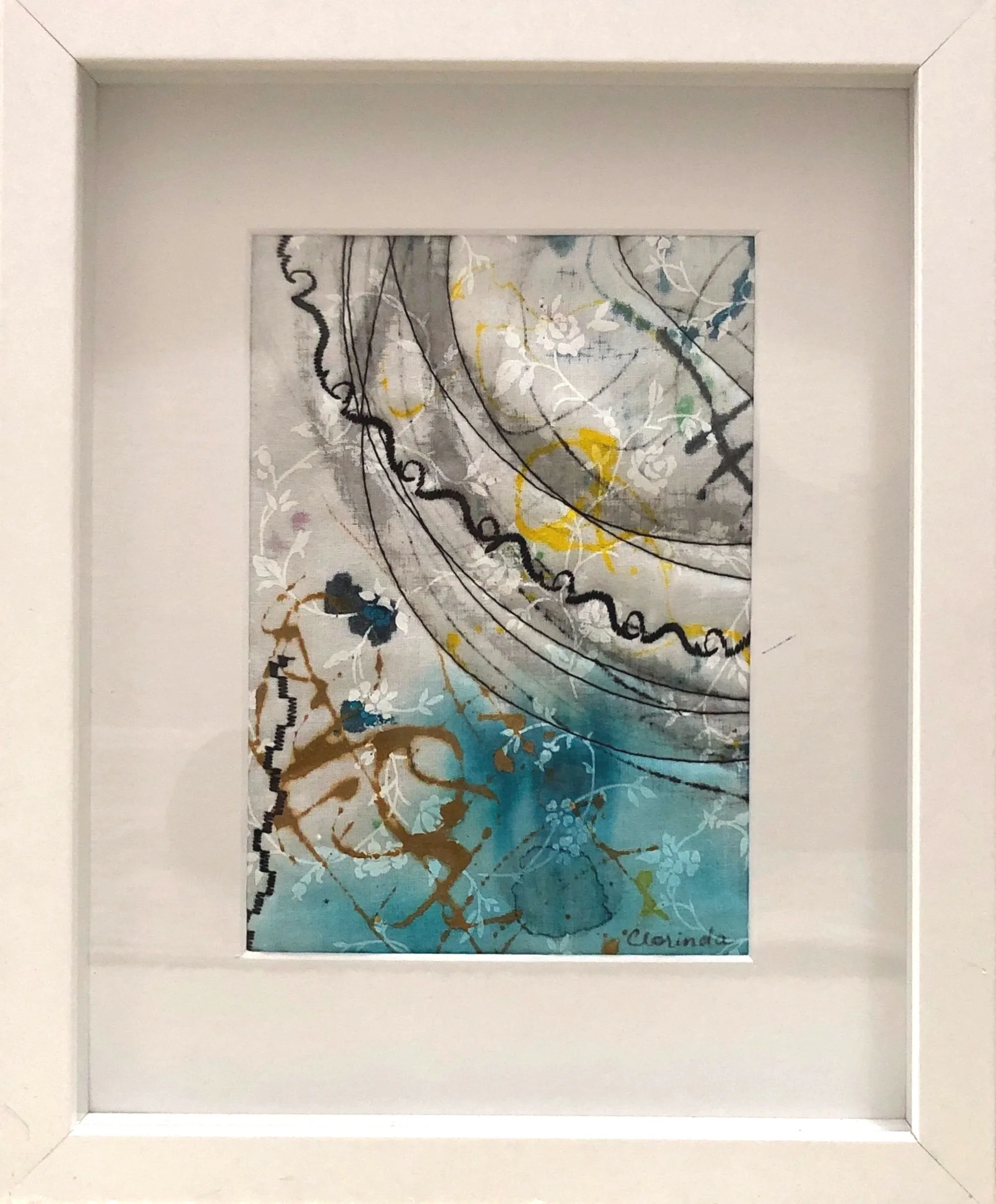 Abstract painting with swirling lines, floral patterns, and splashes of color framed in a square white frame.