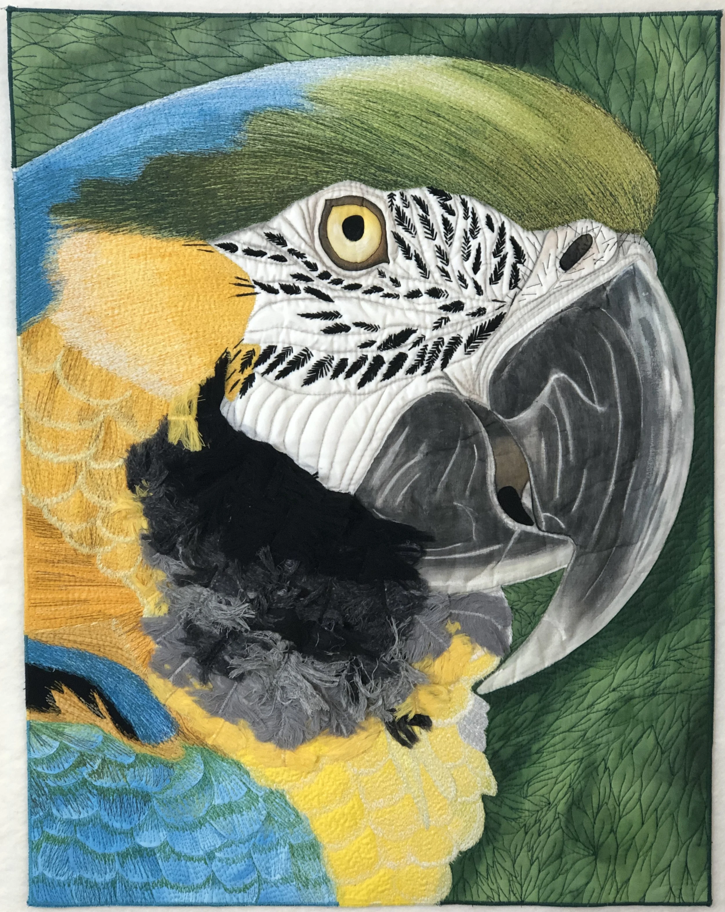 PETER PARROT — Brilliant color, careful mark-making, and a watchful expression celebrate the beauty and personality found in nature. Awards: 2023 Mancuso QuiltFest, Greenville, South Carolina — Judge’s Choice Ribbon; 2023 ShenArts: Shenandoah Arts Co