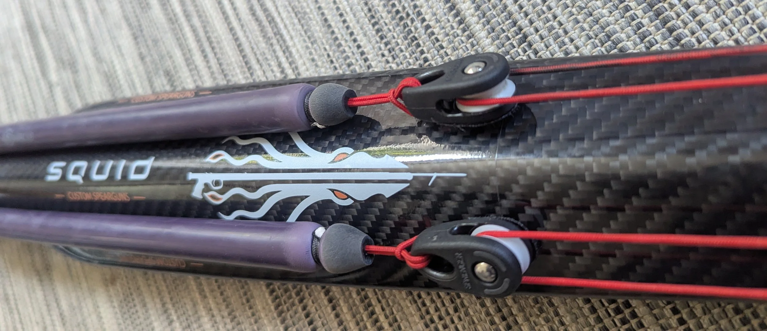 Close-up of a black carbon fibre  squid speargun