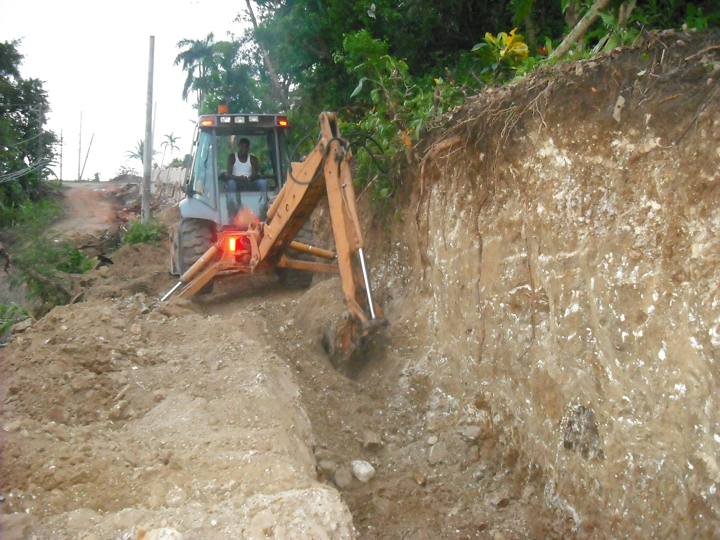 Preparing stone wall foundation