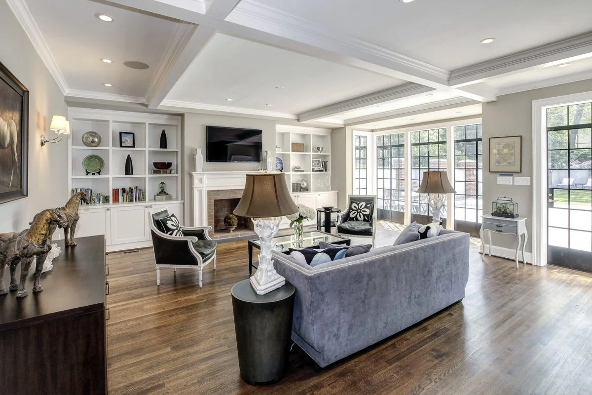 the-family-room-has-a-wall-of-sunny-windows-overlooking-the-garden-out-back.jpg