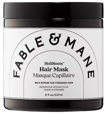 A black jar of Fable & Mane HoliRoots Hair Mask for stressed hair