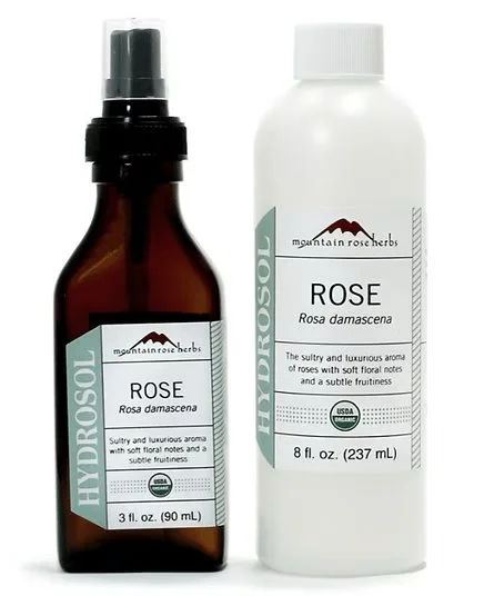 Two bottles of mountain rose herbs rose hydrosol, one in a brown spray bottle and the other in a white spray bottle, labeled as 3 fl oz and 8 fl oz respectively.