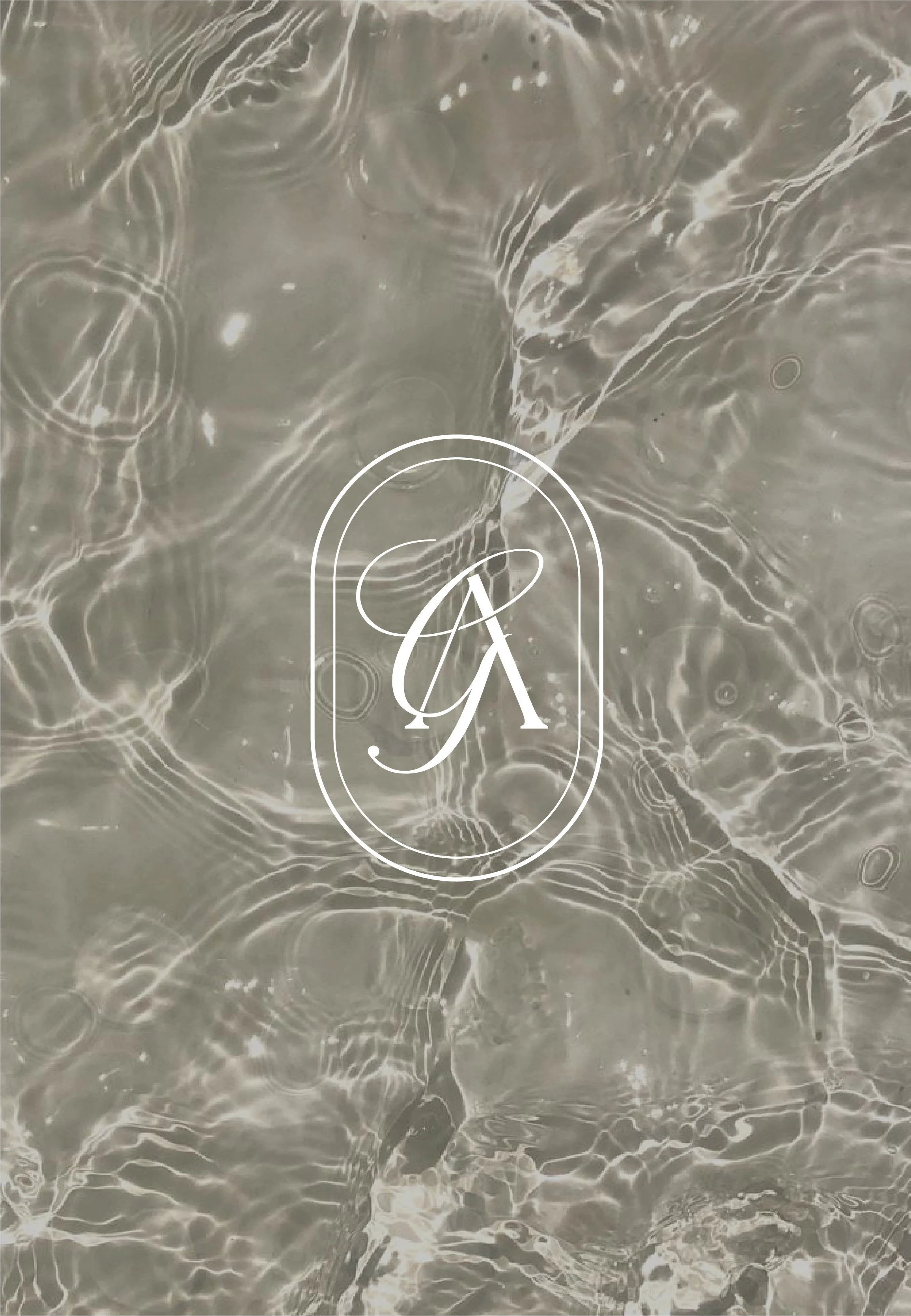 Close-up of water surface with ripples and reflections, with a white logo featuring a stylized ampersand and the letter 'A' in the center.