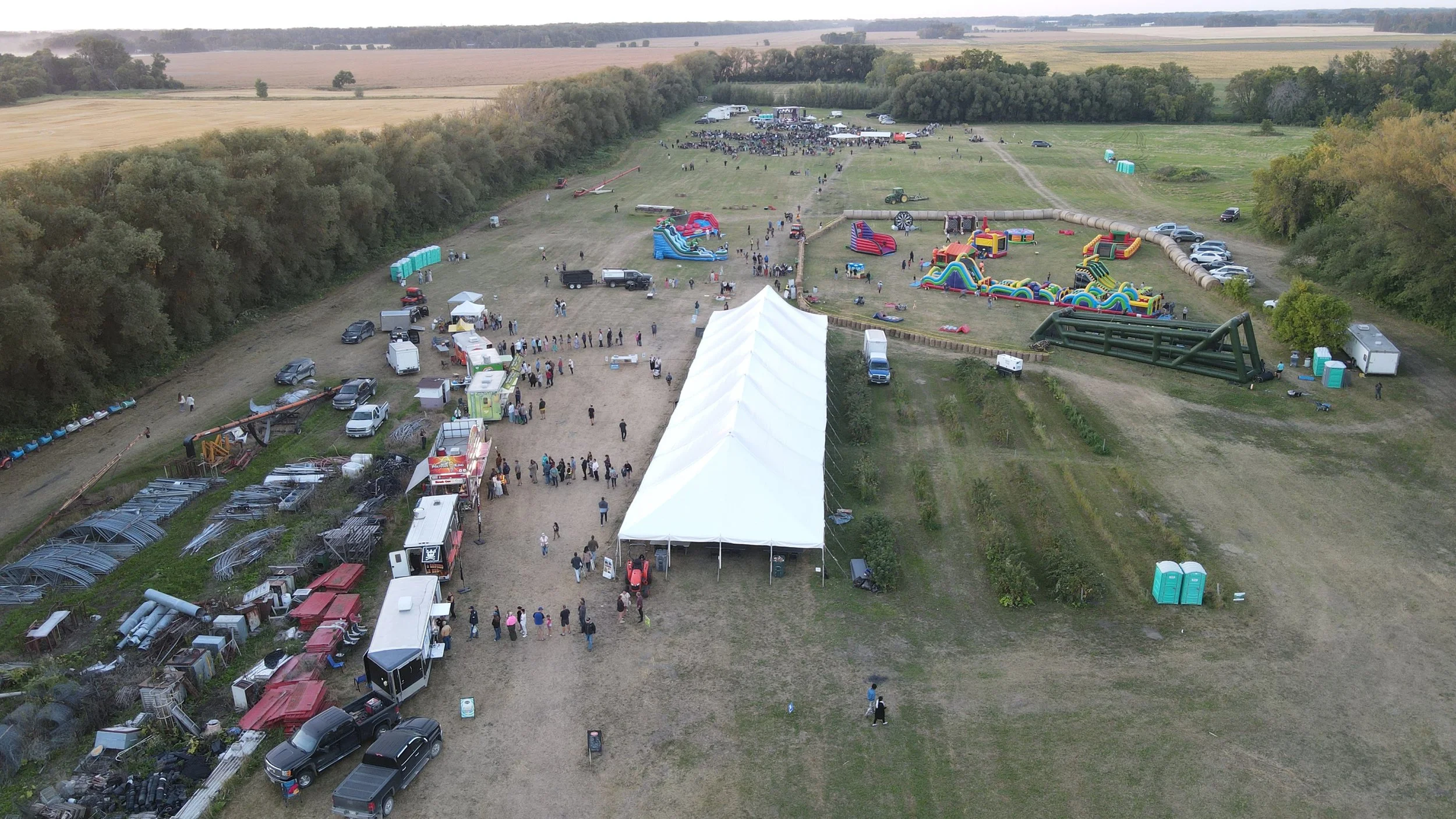 Aerial view of families, activities and the event tent at Fun With Family Day Festival, now Impact 16:15.