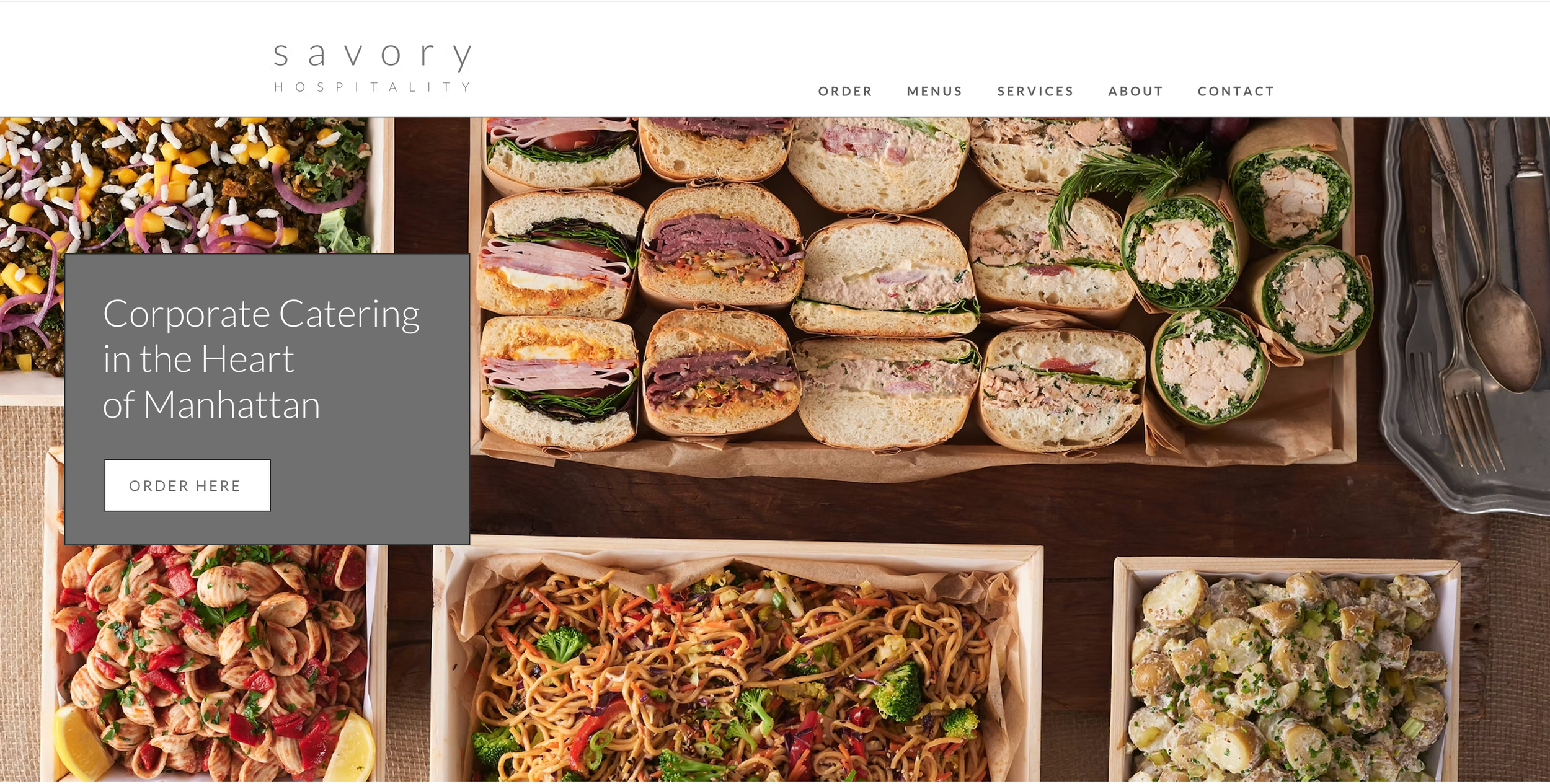 Screenshot of the Savory Hospitality website, showing prepared catering trays and a corporate catering banner