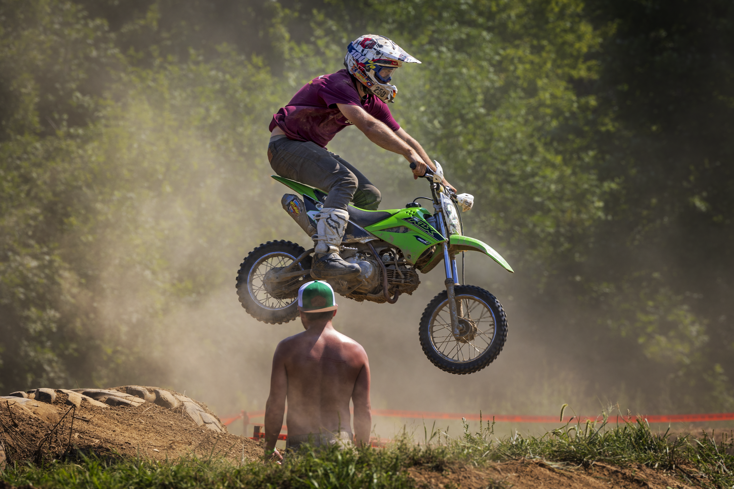 Motocross rider jumping a dirt bike during a race.