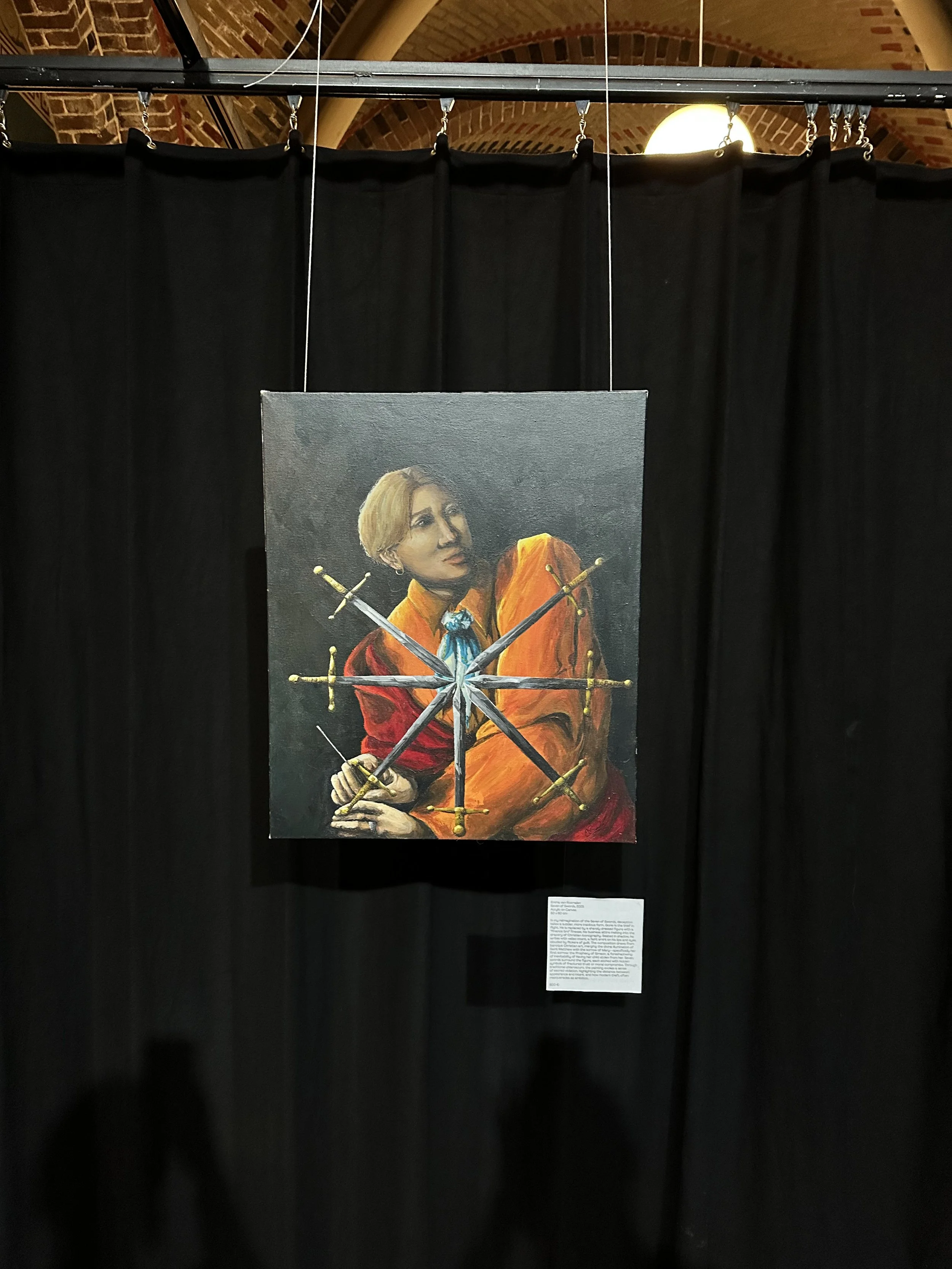 A painting of a man dressed in historical clothing, with short blonde hair, holding seven swords crossed in front of him, against a dark background. Seven of Swords, modern tarot card interpretation