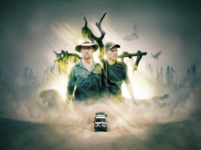 Two men in outdoor clothing stand in front of a surreal, glowing forest scene with bats flying and a truck driving on a dirt road.