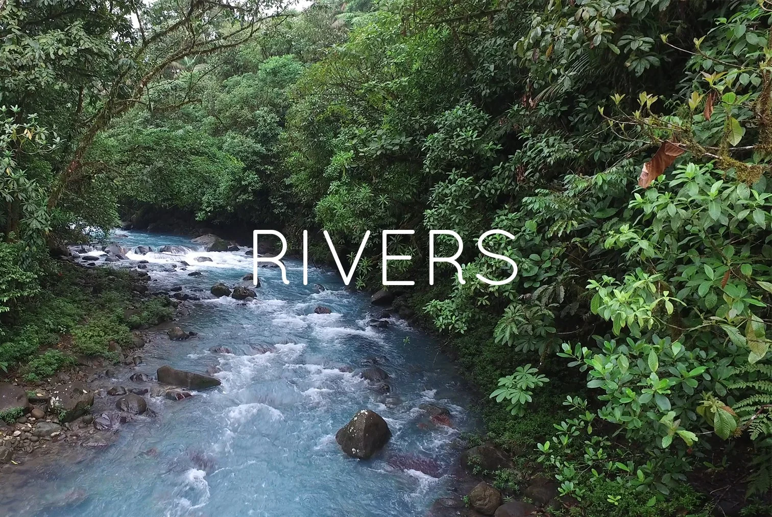 A flowing river in a lush green forest with rocks in the water and the word 'RIVERS' overlaid.