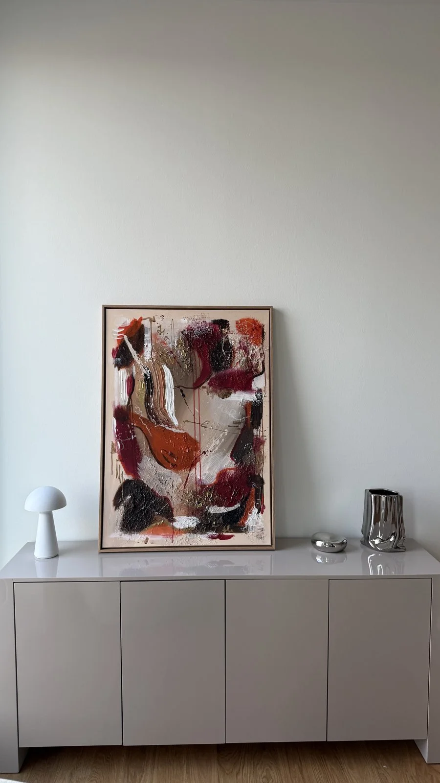 Framed abstract original painting by Sabrina Tina Richter on a sideboard at home – your own Richter as wall art (Wandbild)