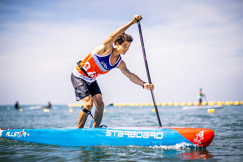 starboard all star hard board paddling through the water