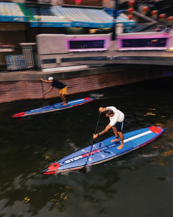 Starboard All Star Airline paddling through the water