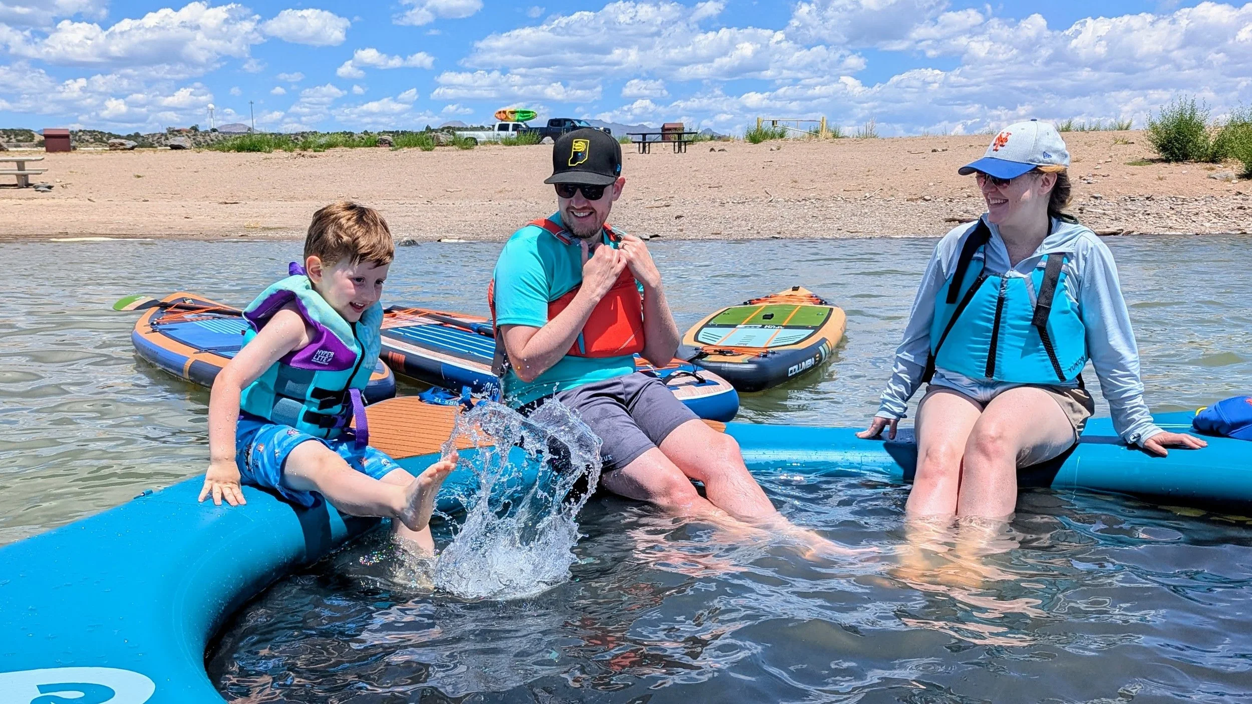 kids and adults wearing PFDs while on the water