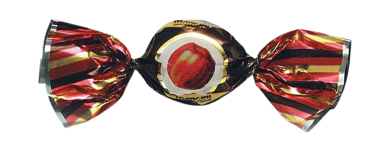 Bonbon au caramel emballé dans un papier de couleur rouge, noir et doré, avec une image de pomme sur l'emballage.