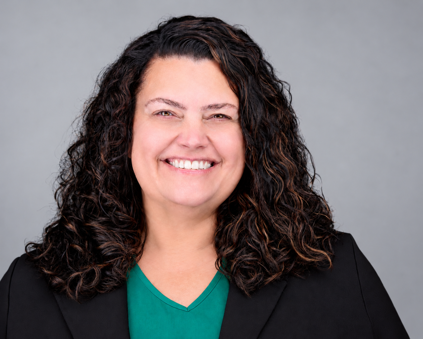Tonia Barrier, MSN, RN, smiling against a light gray background