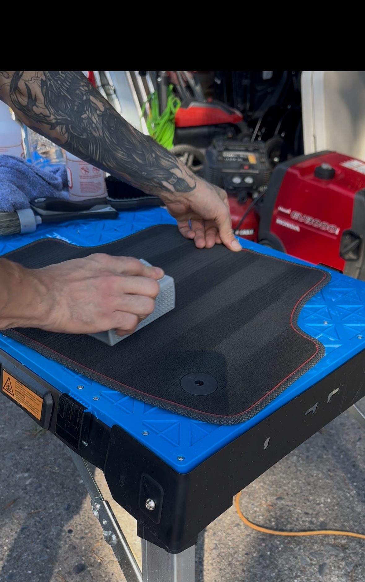 JP creating race lines on floor mats