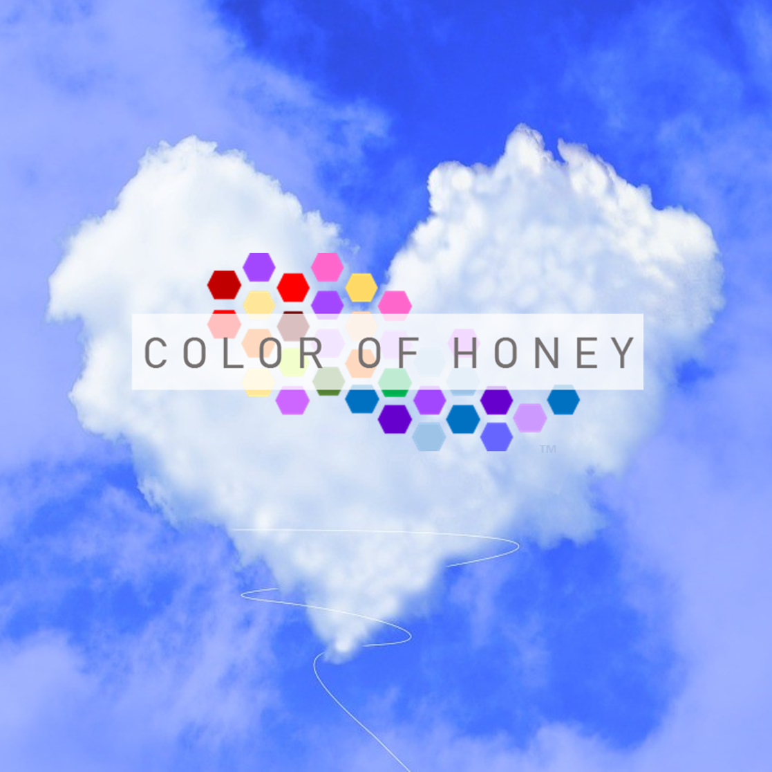 A cloud shaped like a heart with a rainbow funnel leading downwards. Overlayed text reads 'COLOR OF HONEY' with a pattern of colorful honeycomb shapes in the background. The sky is mostly blue with some white clouds.