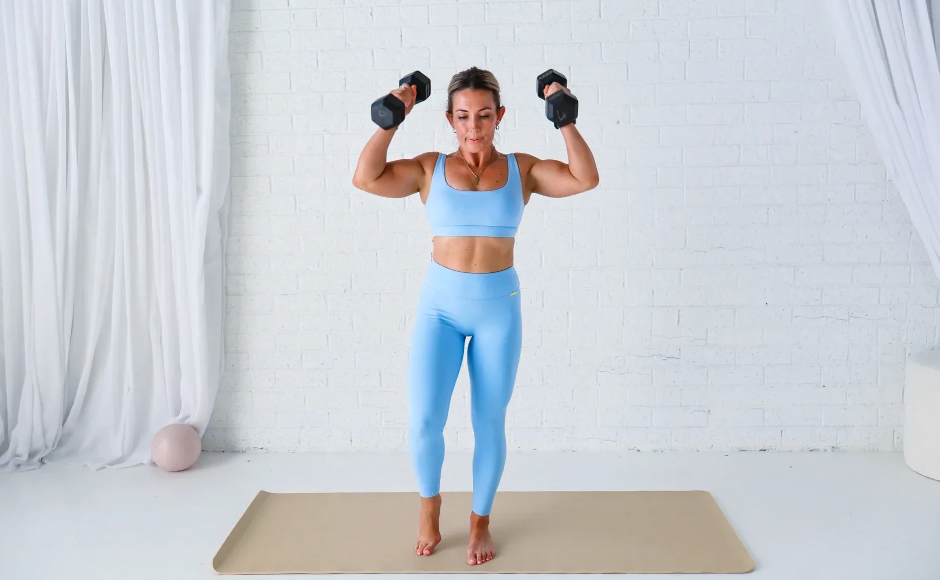 Standing dumbbell shoulder press exercise | Fearless Movement Personal Training Circles Oak Flats