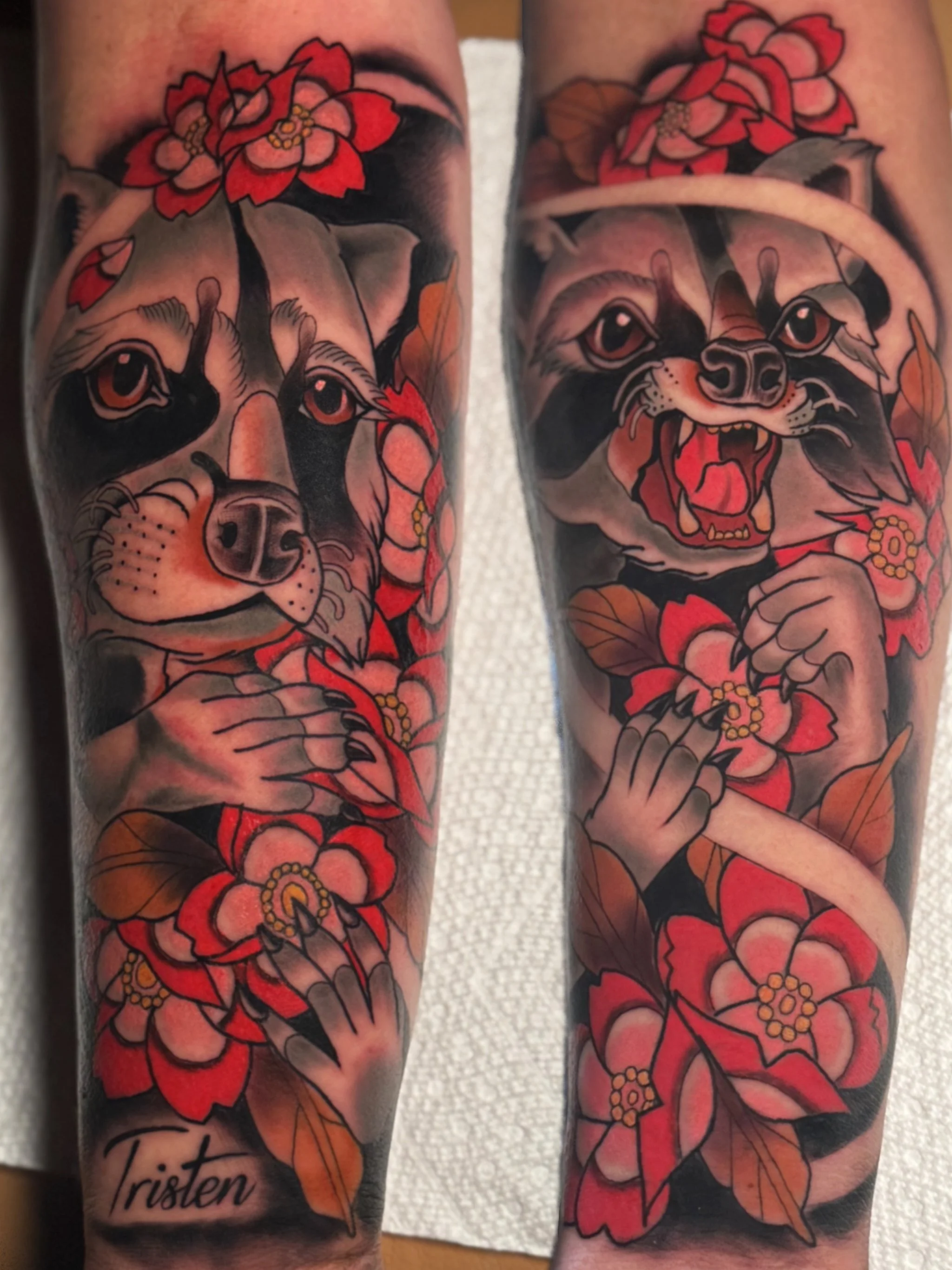 Tattoo of a dog with a confused expression surrounded by red and orange flowers, with the word 'Tristen' written at the bottom.