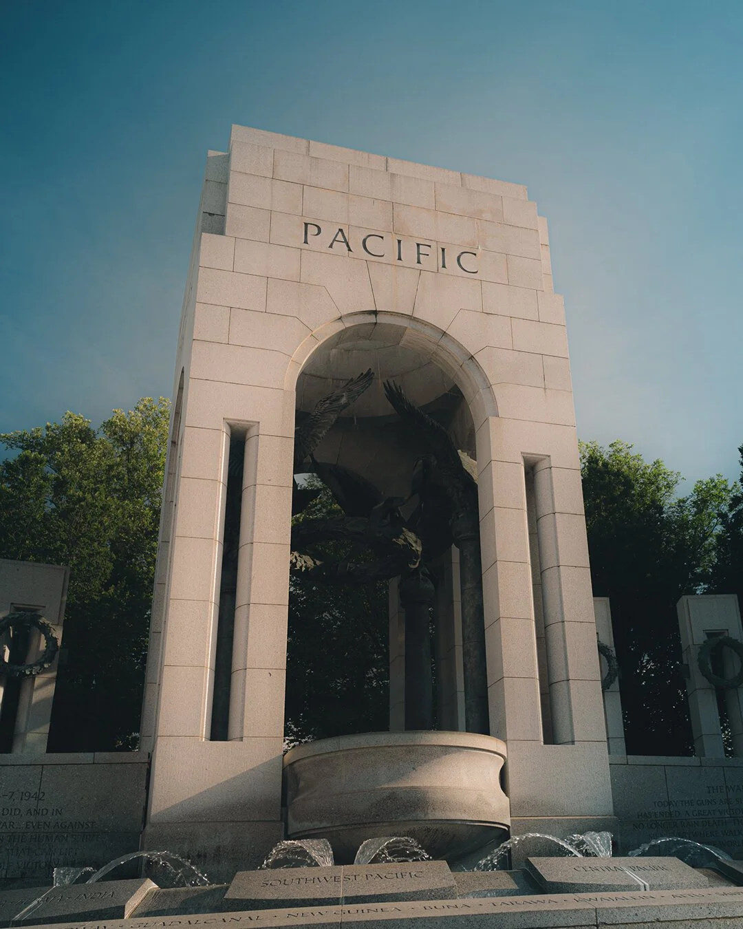 World War II Memorial Pacific arch with eagle sculpture and water fountain, Washington D.C.