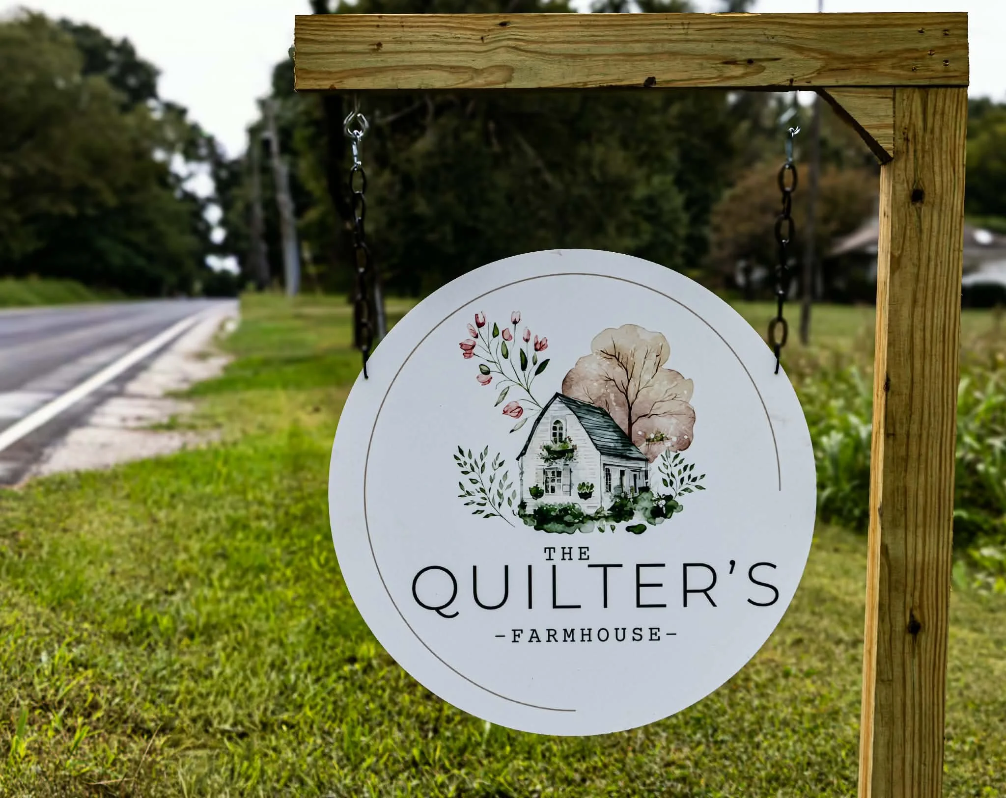 The Quilter’s Farmhouse sign  for quilting and sewing retreat space in Independence, Missouri