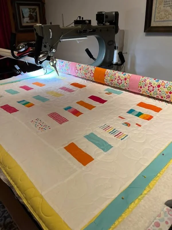 longarm machine with quilt laid over