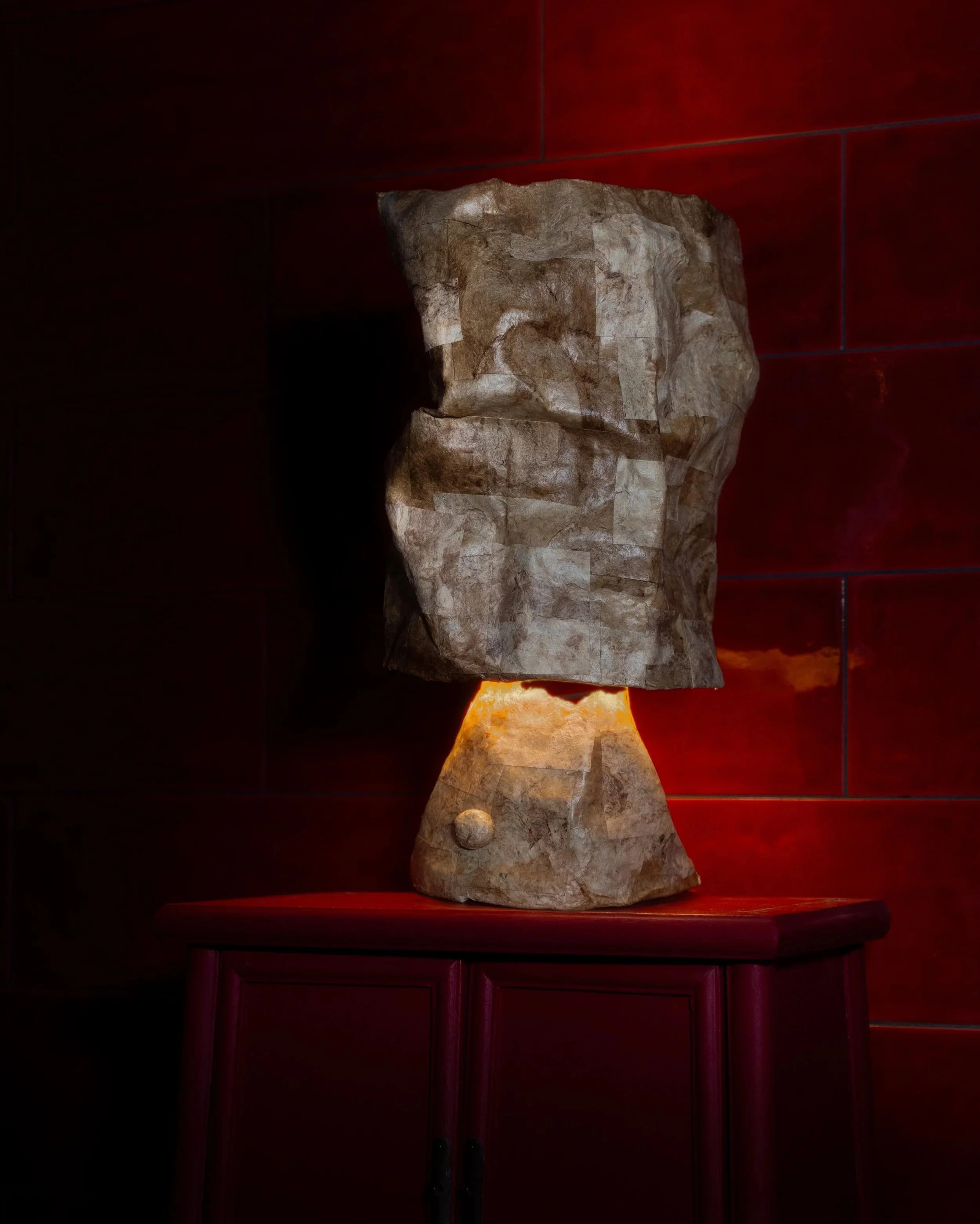 Samuel+Aguirre_Fiber+Table+Lamp+Amate+on+red+LAMP+ON_Photo+Cred+Travis+Lemire.jpg