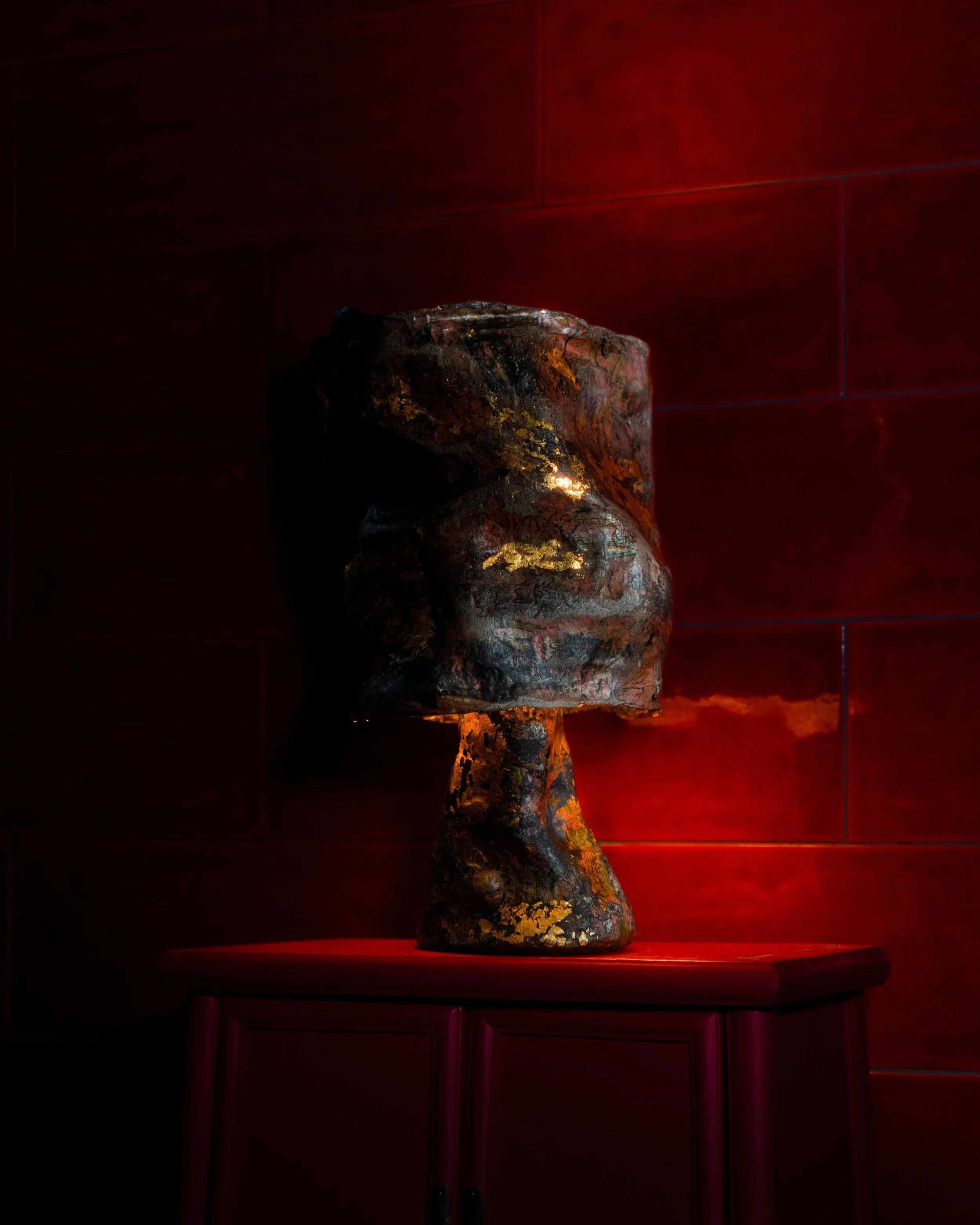 Samuel+Aguirre_Fiber+Table+Lamp+Guilded+Pink+on+red+LAMP+ON_Photo+Cred+Travis+Lemire.jpg