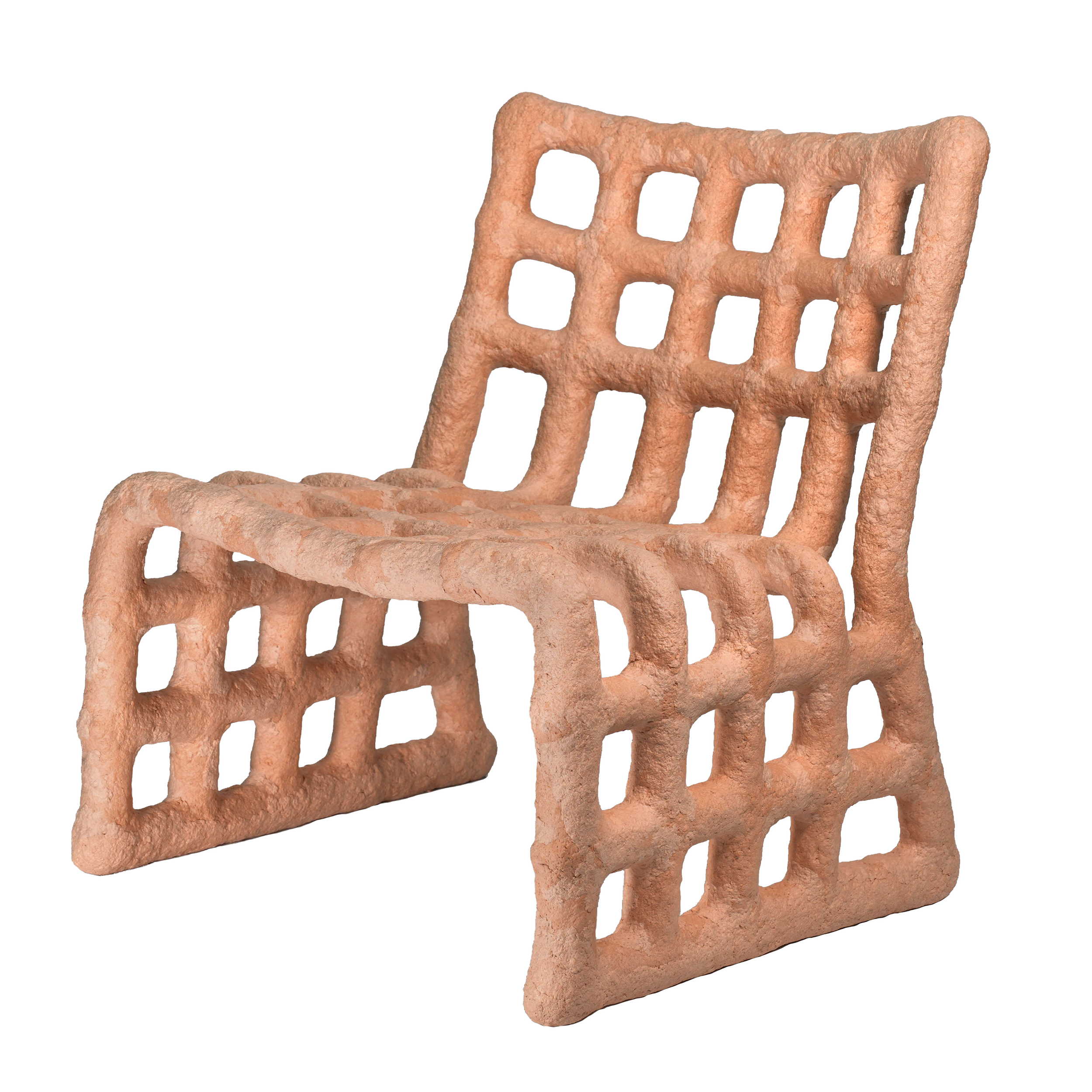 A hand with a beige textured surface holding a rectangular object with multiple holes.