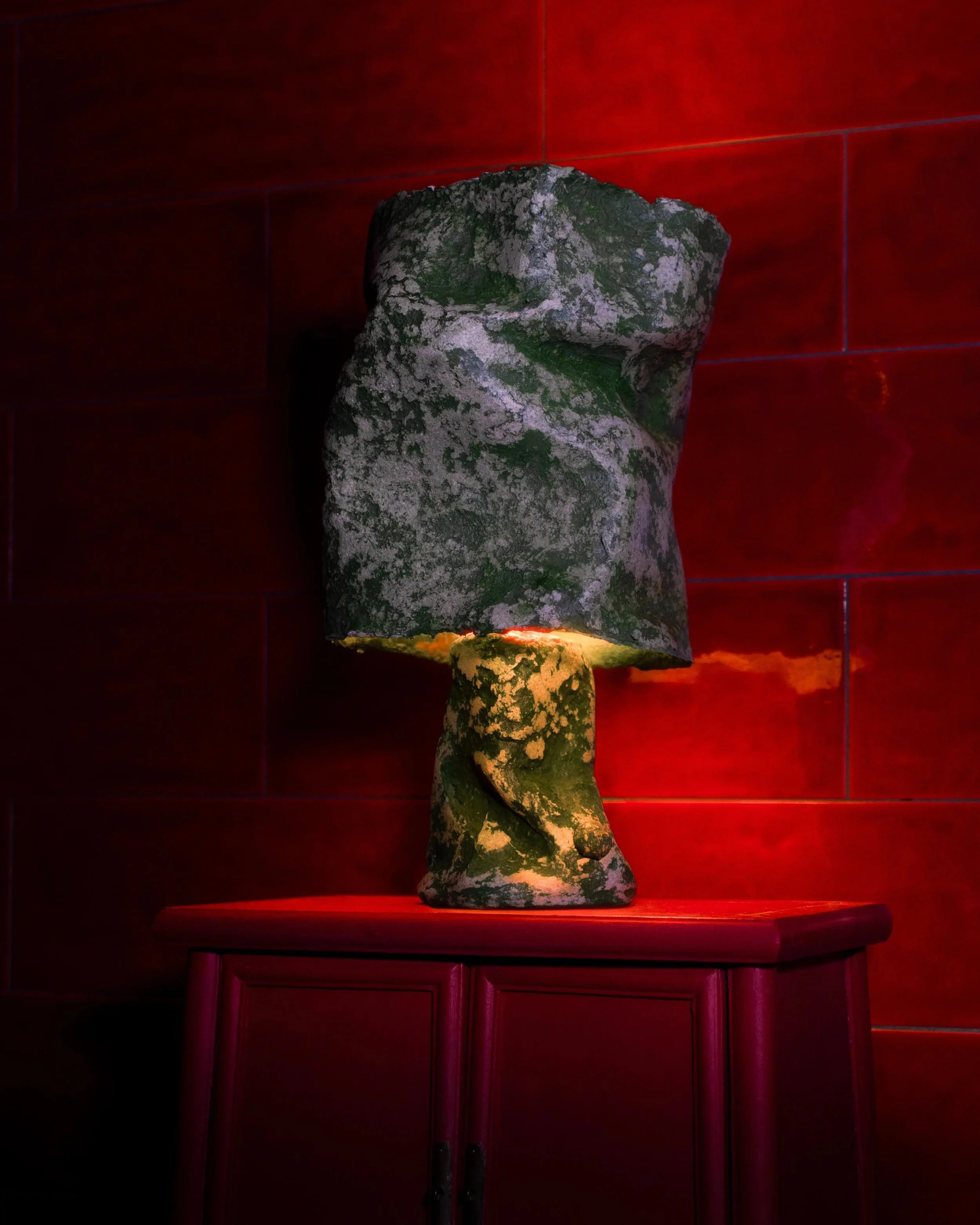 Samuel+Aguirre_Fiber+Table+Lamp+Lily+Pad+on+red+LAMP+ON_Photo+Cred+Travis+Lemire.jpg
