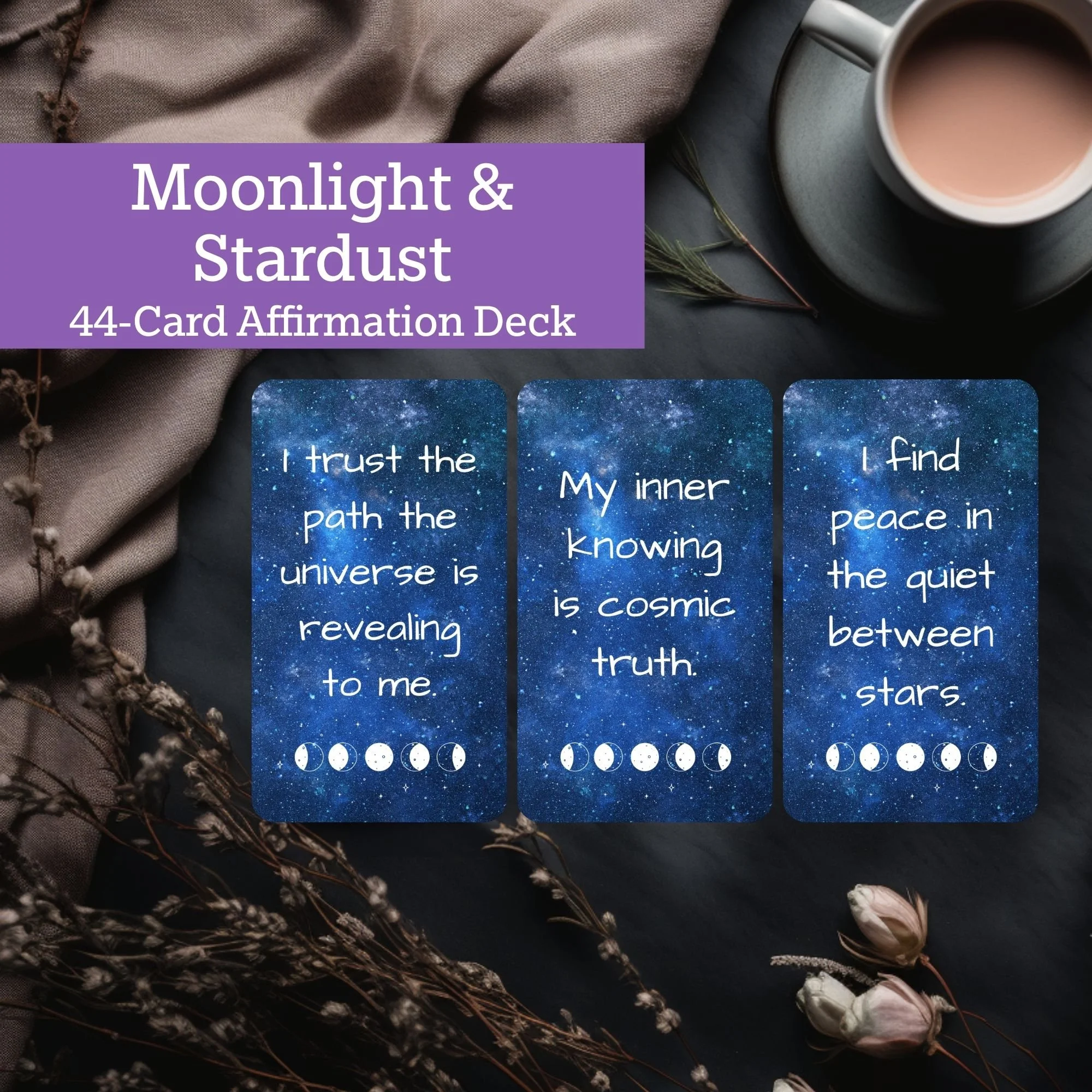 A 44-card affirmation deck titled 'Moonlight & Stardust' with cards displayed against a dark starry background, a cup of coffee, dried flowers, and fabric.
