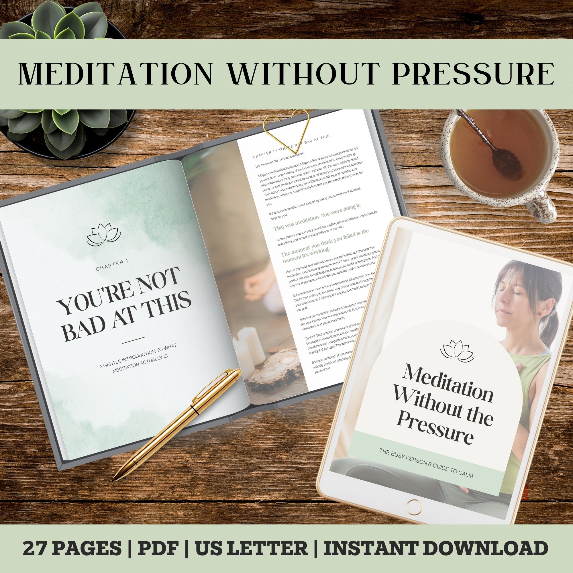 A flat lay image of an open book titled "Meditation Without the Pressure", a smartphone showing a meditation guide, a gold pen, and a cup of tea on a wooden surface, with a small succulent plant in a black pot.